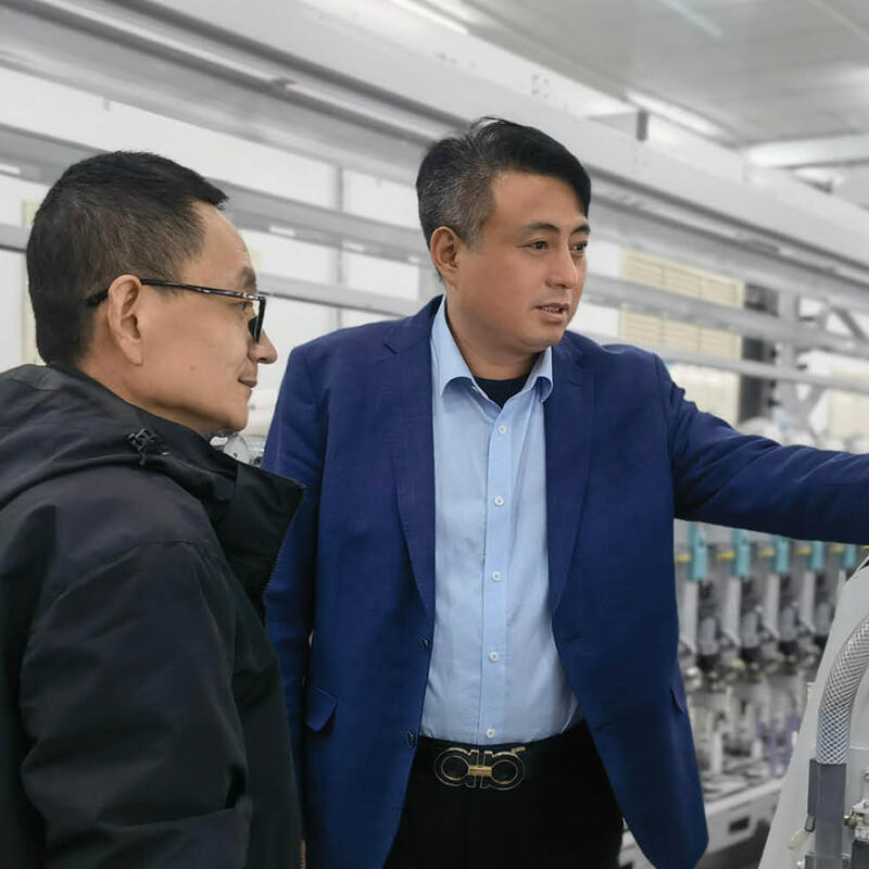 293 Huasheng image Mr Zhang and Wang Zhiheng working in the mill